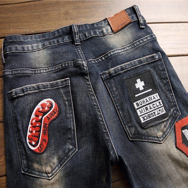 Men's Ripped Jeans with Badge Patches - Trendy and Stylish